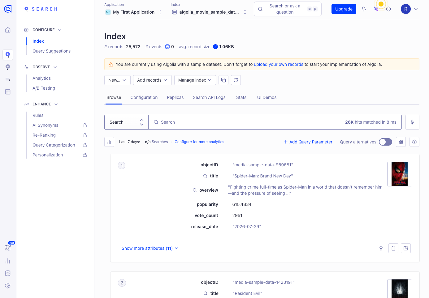 Algolia Search Index page for the sample movie dataset showing 25,572 records, 26K hits matched in 8 ms, a sample dataset warning, and AI Synonyms, Re-Ranking, Query Categorization and Personalization with lock icons in the Enhance menu